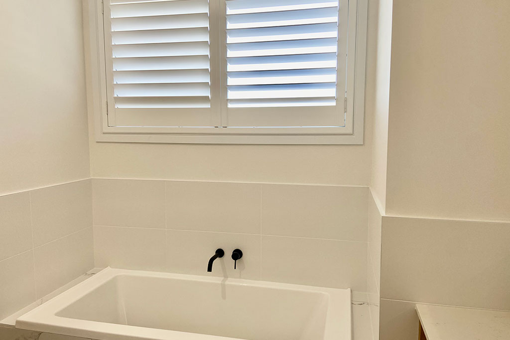 White shutters used in bathroom